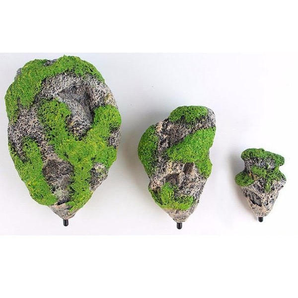 Декорація в акваріум летять камені